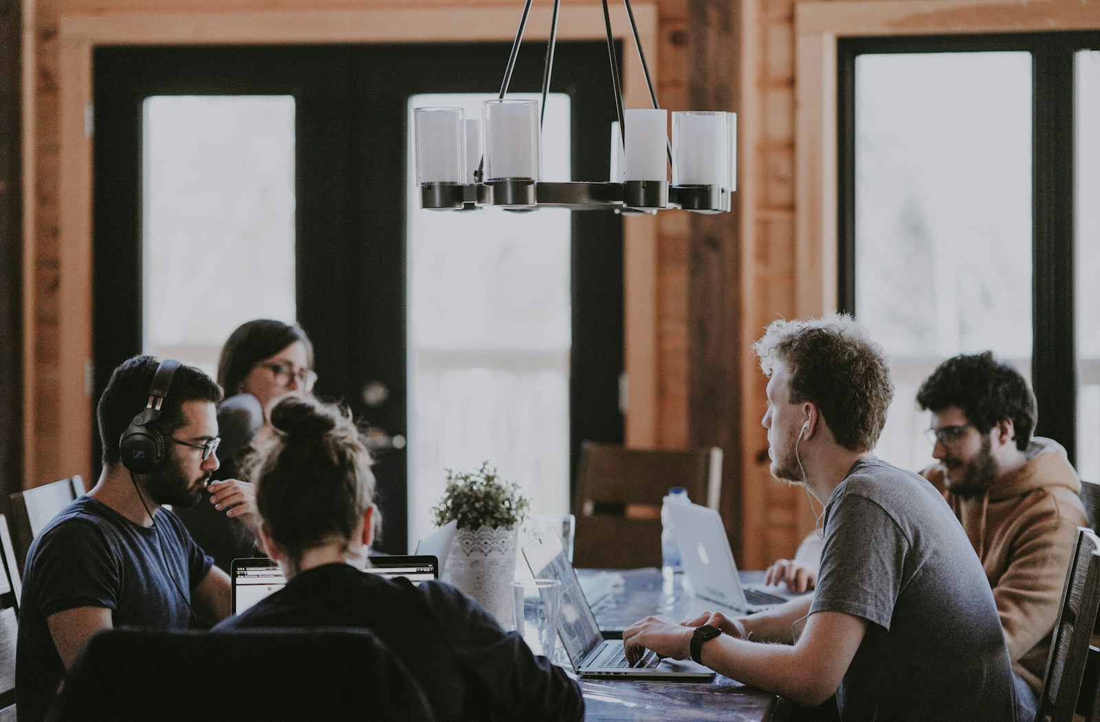 Employee sitting inside meeting room to discuss competitors strength and weaknesses. 