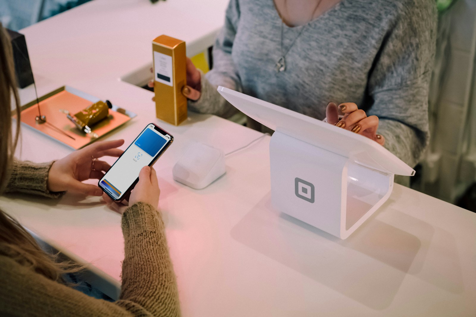 Employee using a tablet to help a customer sign up for a loyalty program in seconds