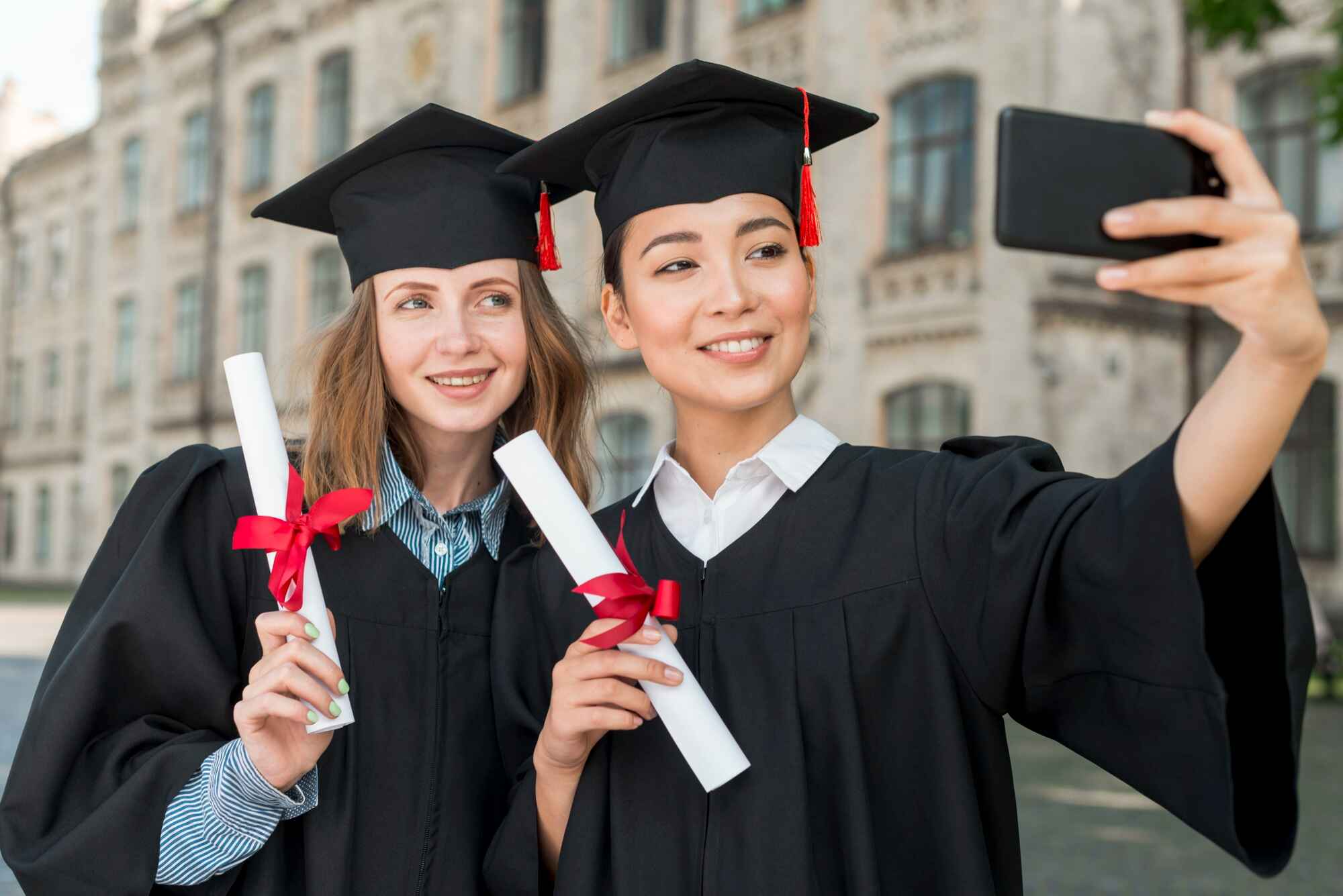 Students taking selfie at graduation.